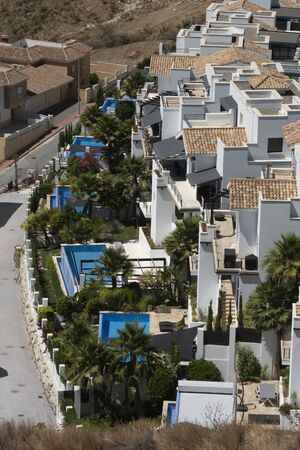 Benalmadena, SPAIN - JUNE 19, 2019: White townhouses with pool. On the Mediterranean coast of Malaga, Spainのeditorial素材