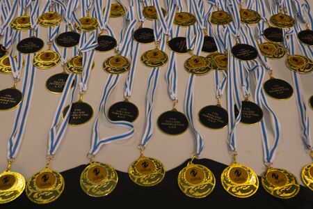 TEIXEIRO, SPAIN - JANUARY 15, 2020: Sports medals. Set of sports medals of the Galician powerlifting championshipのeditorial素材