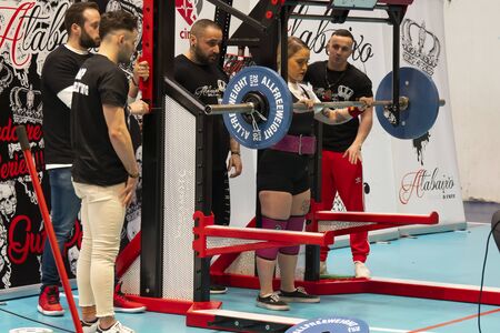 TEIXEIRO, SPAIN - JANUARY 15, 2020: Galician Powerliftng Championship. Girl about to perform a squat in an official competitionのeditorial素材