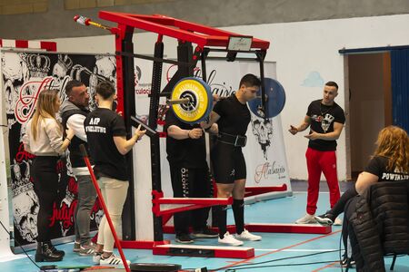 TEIXEIRO, SPAIN - JANUARY 15, 2020: Galician Powerliftng Championship. Man about to perform a squat in an official competitionのeditorial素材