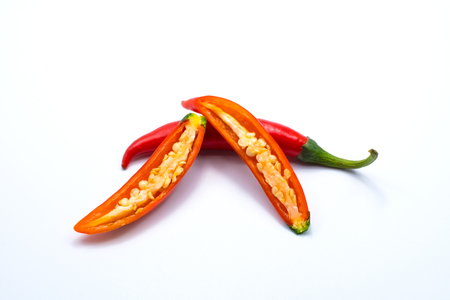 Close up sliced red chilli pepper isolated on white background.の写真素材