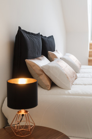 House decoration details pillows and lamp in bedroom