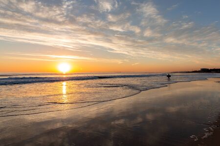 Beautiful sunset on the Carcavelos beach, Cascais, Lisbon, Portugalの写真素材