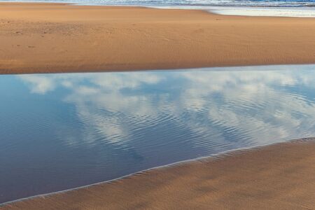 Beautiful sunset on the Carcavelos beach, Cascais, Lisbon, Portugalの写真素材