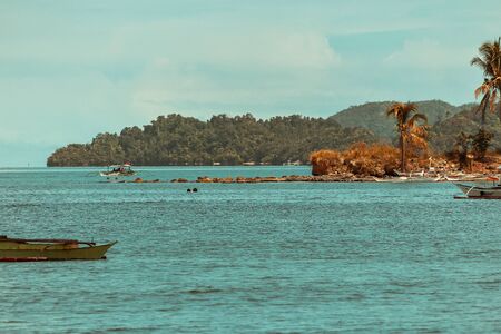 Tropical landscape with rock islands, crystal clear water, Palawan, Philippinesの写真素材