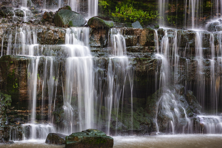 Photo of Waterfall mountain view close up. Mountain river waterfall landscape.の写真素材