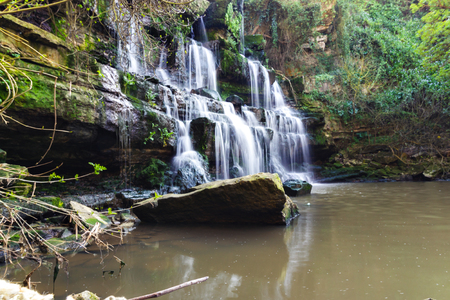 Photo of Waterfall mountain view close up. Mountain river waterfall landscape.の写真素材