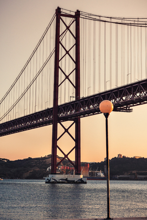 Sunset in Lisbon, 25 de Abril Bridge, Tagus River, Lisbon, Portugalのeditorial素材