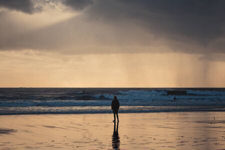 Beautiful sunset on the Carcavelos beach, Cascais, Lisbon, Portugalの写真素材