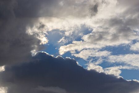Blue sky background with cloudsの写真素材