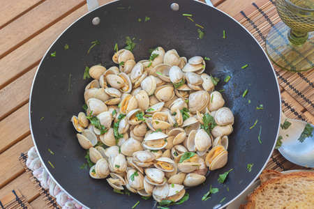 Clams cooked in a pan, healthy lunchの写真素材