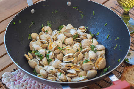 Clams cooked in a pan, healthy lunchの写真素材