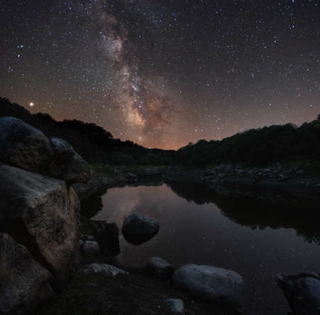 Mars and the Milky Way on the Minho River, near Portomarin, on the Way of Saint James, Galicia,...