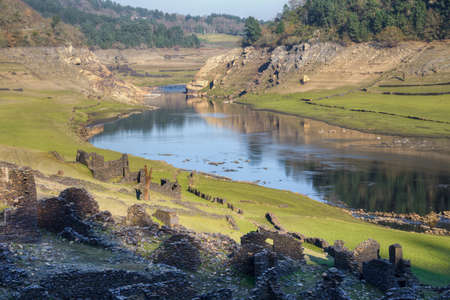 The ruins of an old village emerge from the waters of the river MiÃ±o when lowering the level of...