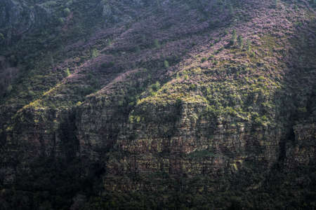 Quartzite cliff showing geological folding bands in the Geopark Mountains of Courel
