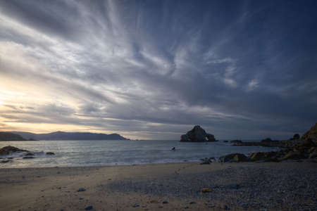 Dark clouded sunset on the beach of O Carro, Espasante, Galicia