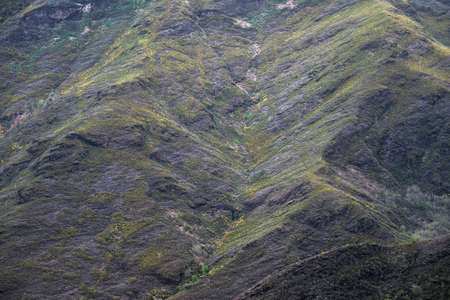 Geological strata on the slopes are observed when the vegetation cover is lost due to the summer...