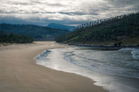 The waves cover a beach as the tide rises near Espasante Galiciaの写真素材