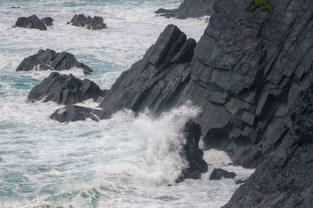 The Cantabrian Sea hits the black slate cliffs of Loiba in Espasante Coruna Galicia