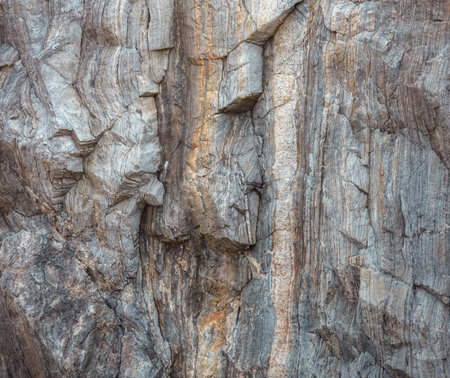 Close up view of the cracks and fissures in the granite cliffs of Punta Moras in Xove Lugo Galicia