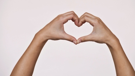 Female hands shaping a heart の写真素材