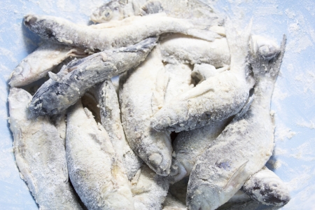 small fish in wheat flour in plate