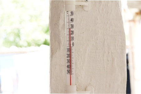 mercury thermometer showing thirty degrees on celsius