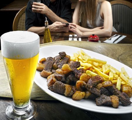 Picanha with fries and beerの写真素材