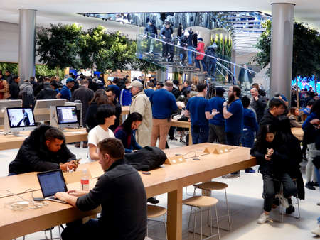 NEW YORK - FEBRUARY, 2020: People visiting the Apple Store on 5th Avenue. Apple Inc. is an American...