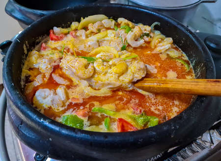 Moqueca with shrimp, fish, palm oil, cilantro, coconut milk