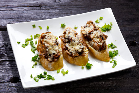 Mushroom bruschetta and grated parmesanの写真素材