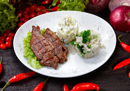 Beef steak with potatoes and riceの写真素材