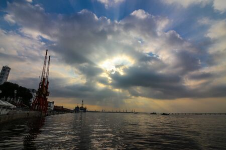 Rio de Janeiro, Brazil, June 27, 2018: View of the sunset in the port region of Rio de Janeiro, in the waters of Guanabara Bay in the Atlantic Ocean.のeditorial素材