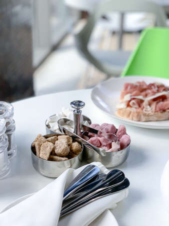 beautiful breakfast served in the restaurant, in white tones