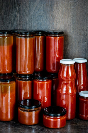 glass jars with homemade tomato sauceの写真素材
