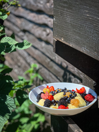 Lazy vareniki with seasonal berries in a white plateの写真素材