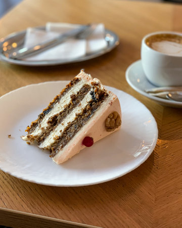 Delicious Layered Cake with Coffee in Modern Caf Settingの写真素材