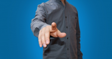 Businessman pressing an imaginary buttonの写真素材
