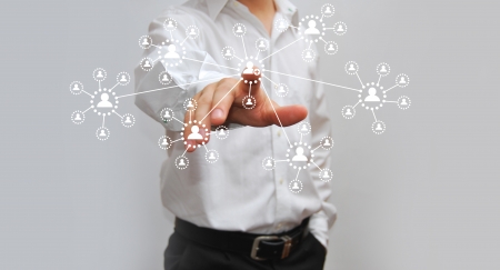 Businessman pressing virtual media type of buttons の写真素材