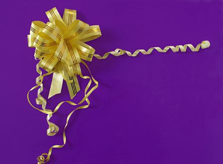 Photo bow tie yellow ribbons on purple background.                    の写真素材