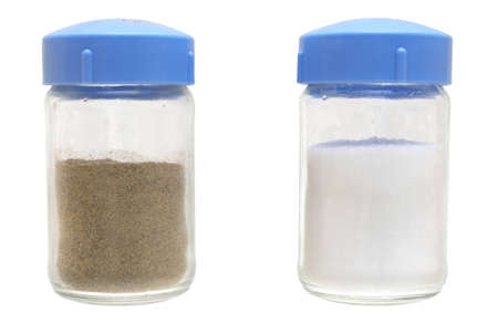 Black ground pepper and salt on a white background.                   の写真素材