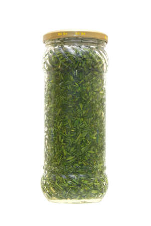 Tinned greens in a glass jar on a white background.                   の写真素材