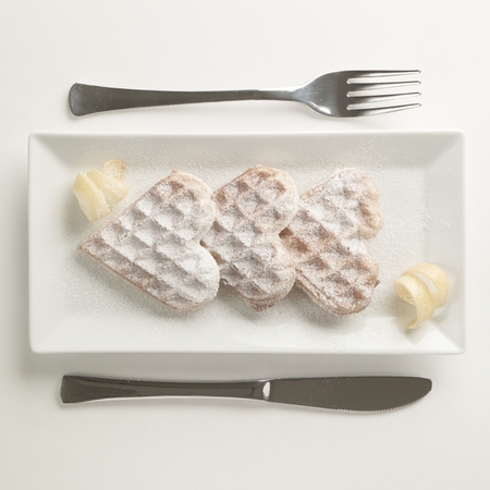 Heart shaped waffles with lemon zestの写真素材