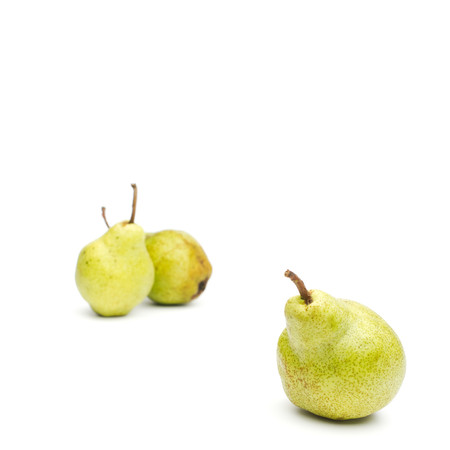 Three Williams sort pears isolated against white background selective focus on front pear. Square crop. Copy space.の写真素材