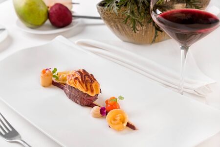 Baked deer fillet with Jus sauce and root vegetables - deer fillet with game Jus, baked with pear...