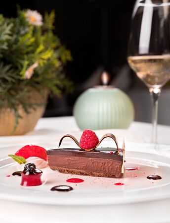 Chocolate and raspberries palette - tart rate with Ghana dehydrated raspberries and sherry Mariner, raspberry mousse,chocolate sphere and raspberry sorbetの写真素材