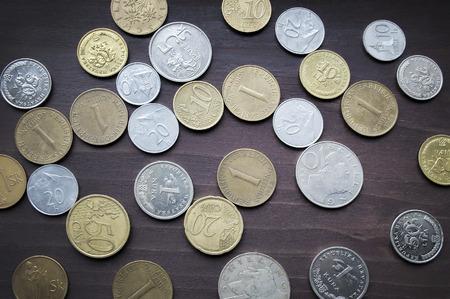 Various european coins collection on old wooden tableの写真素材