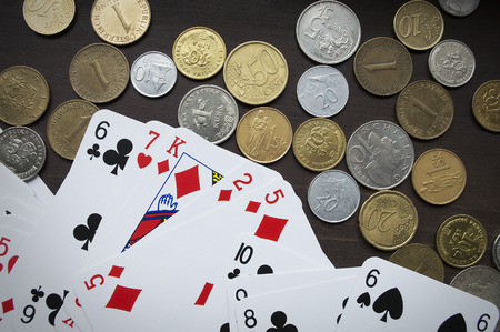 Coins and playing cards top viewの写真素材