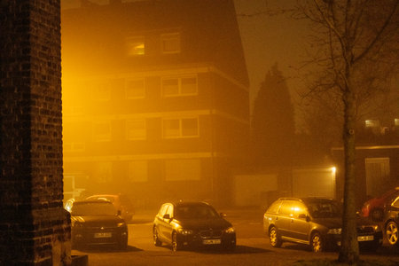 2021 04 03, Duisburg, Germany: Three cars standing in thick fog, illuminated from the sideのeditorial素材