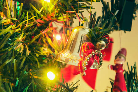 Detail of christmas tree decoration. Merry Christmas and happy New Year, 24th of December. Close up view of Christmas tree twig with ornamentsの写真素材